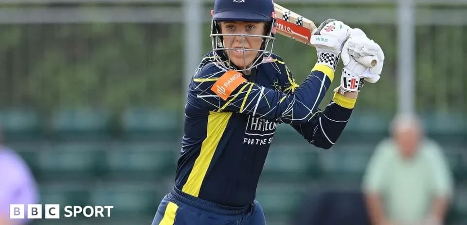 Batter preparing to hit ball during cricket match