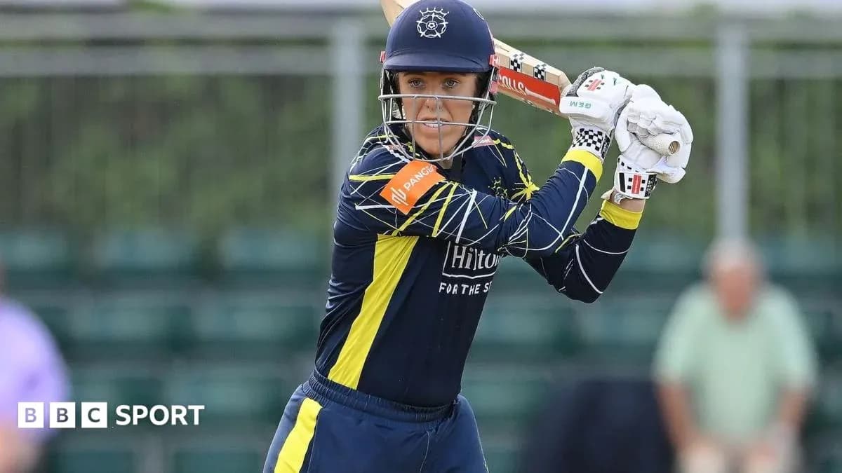 Batter preparing to hit ball during cricket match