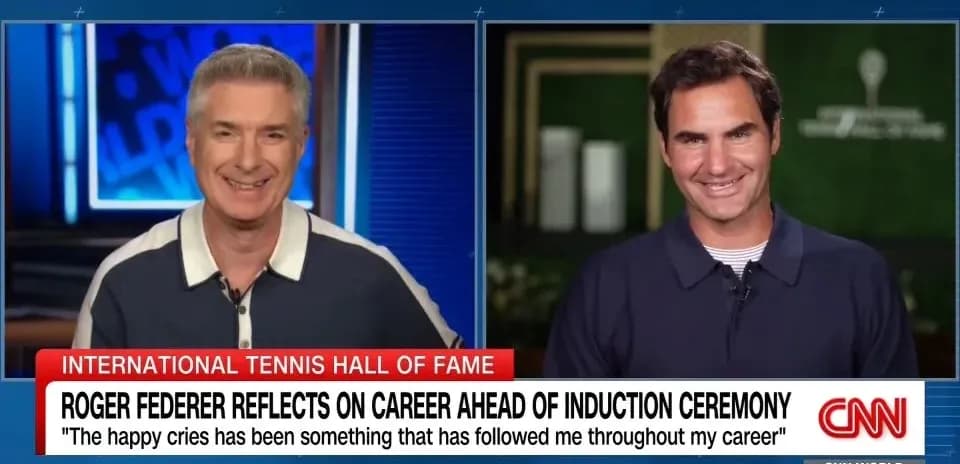 Two men discussing Roger Federer's career on CNN