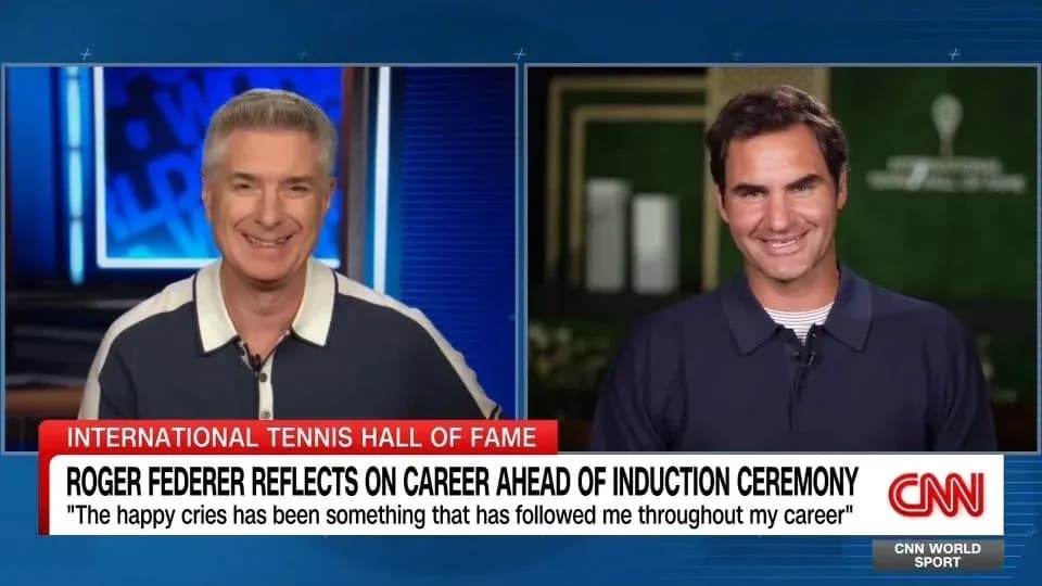 Two men discussing Roger Federer's career on CNN