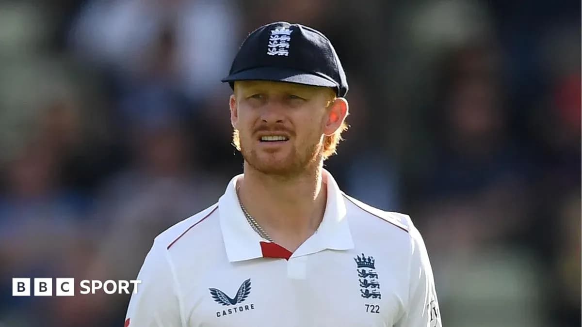 Cricketer wearing England kit on the field