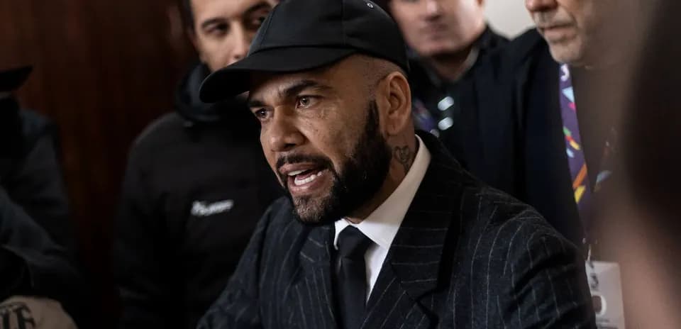 Man speaking passionately surrounded by onlookers