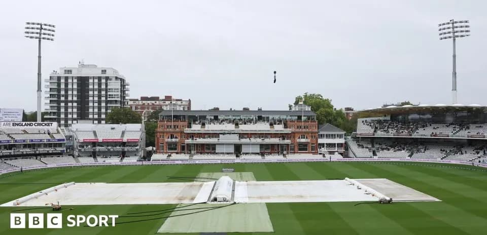 Cricket ground with covers on pitch at Lord's