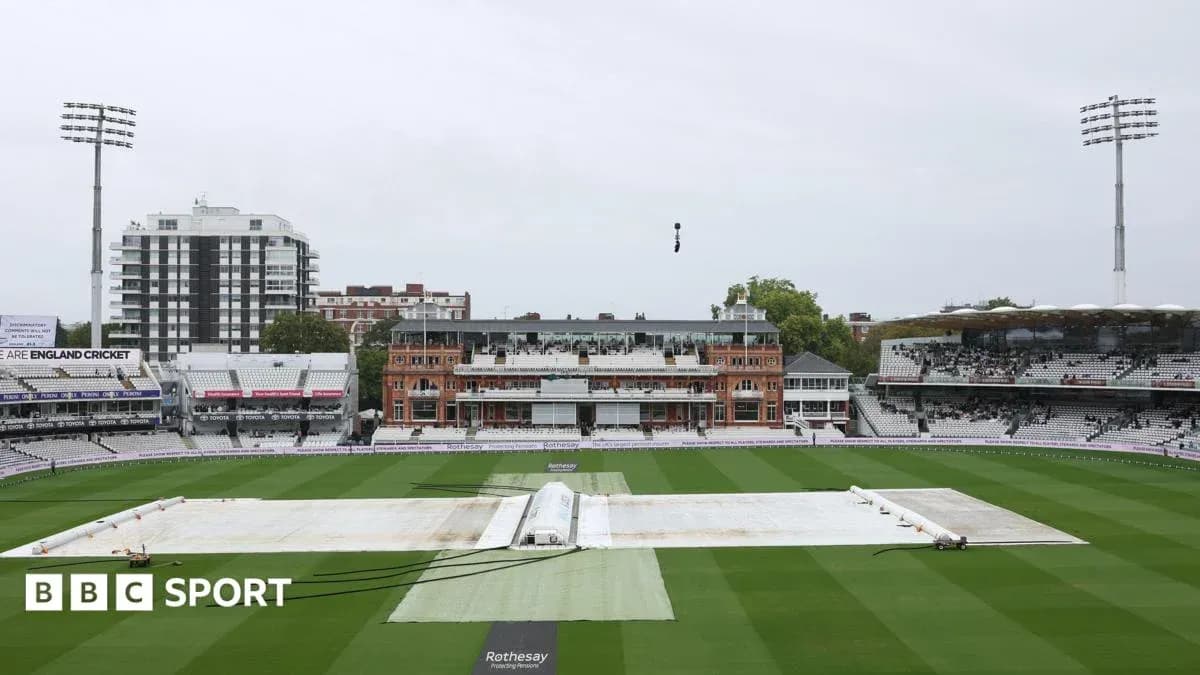 Cricket ground with covers on pitch at Lord's