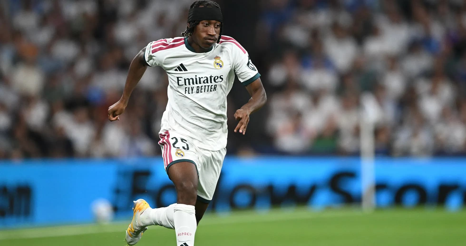 Player running with ball during Real Madrid match