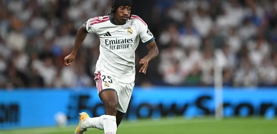 Player running with ball during Real Madrid match