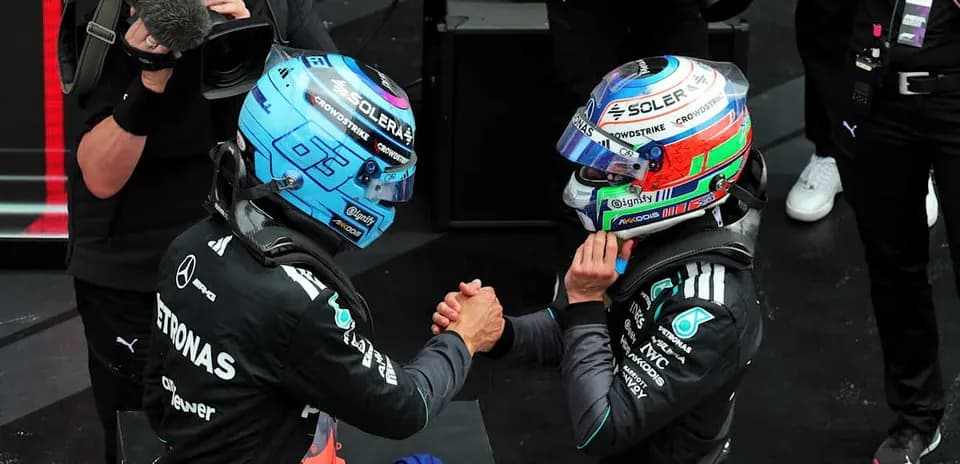 Two drivers shaking hands after a race