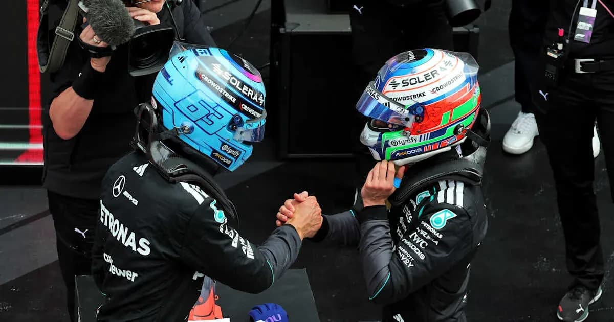 Two drivers shaking hands after a race