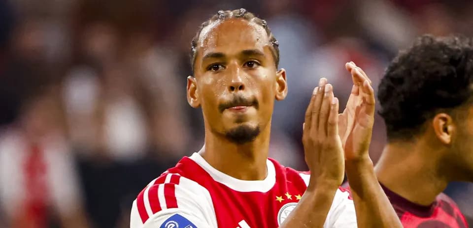Player applauding fans after match in stadium