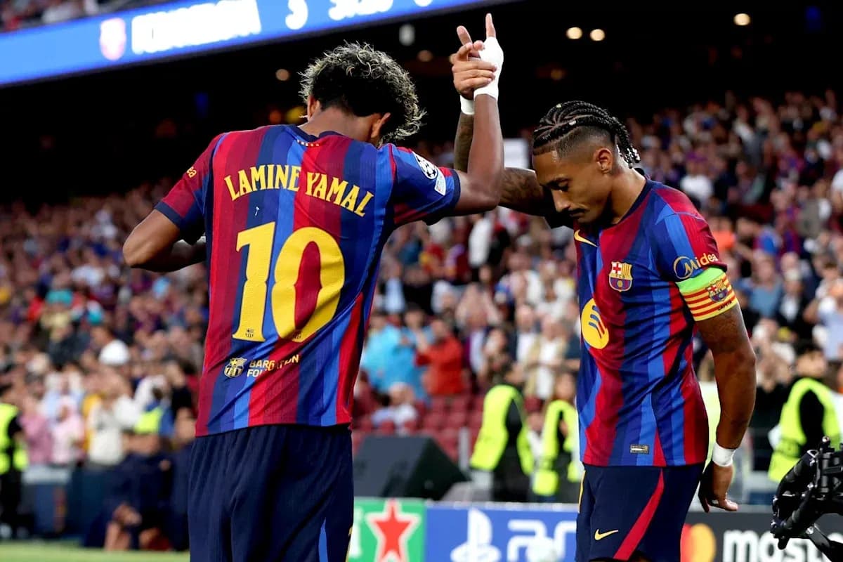 Lamine Yamal celebrating with teammate during match