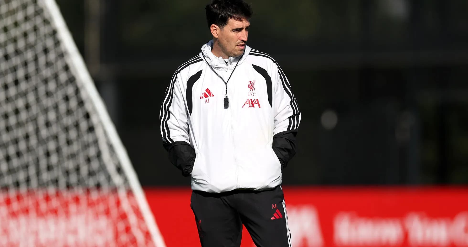Coach observing during Liverpool training session