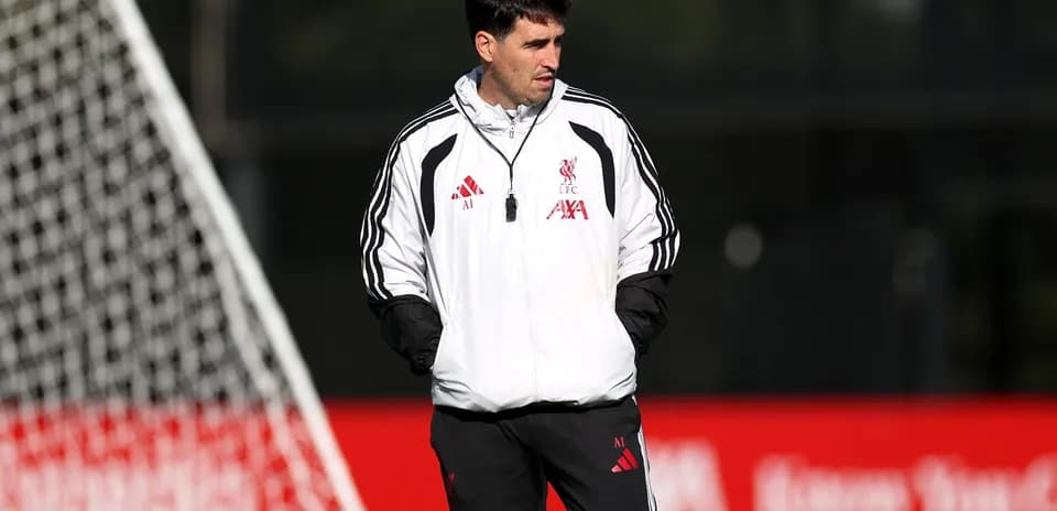 Coach observing during Liverpool training session