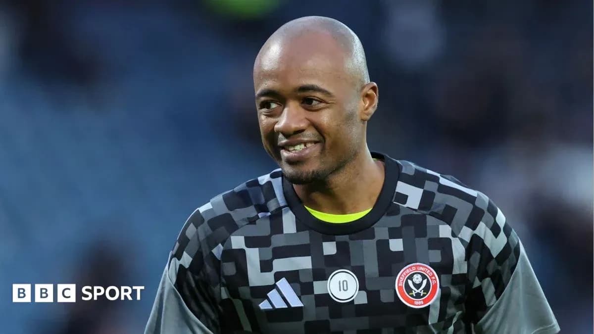 Goalkeeper smiling in Sheffield United kit