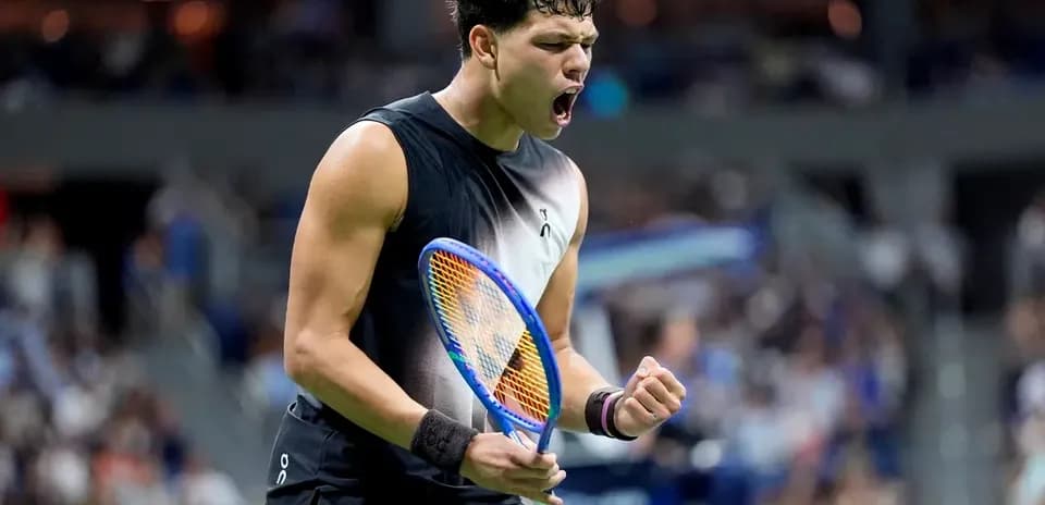 Tennis player celebrating a point during match