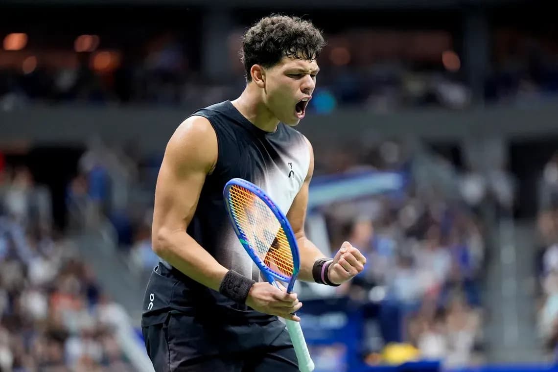 Tennis player celebrating a point during match