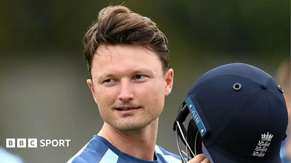 Cricketer holding helmet during practice session