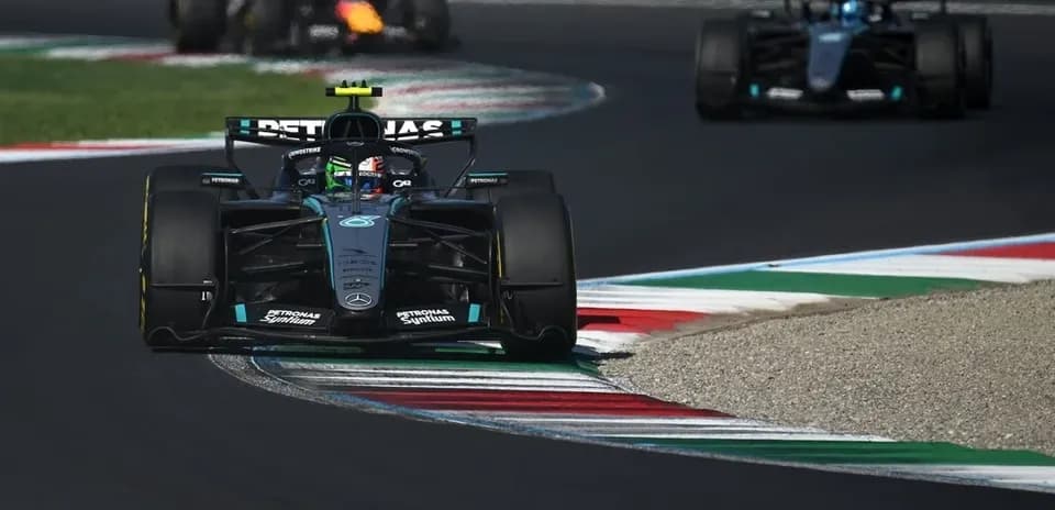 Mercedes car leading on track during Formula 1 race