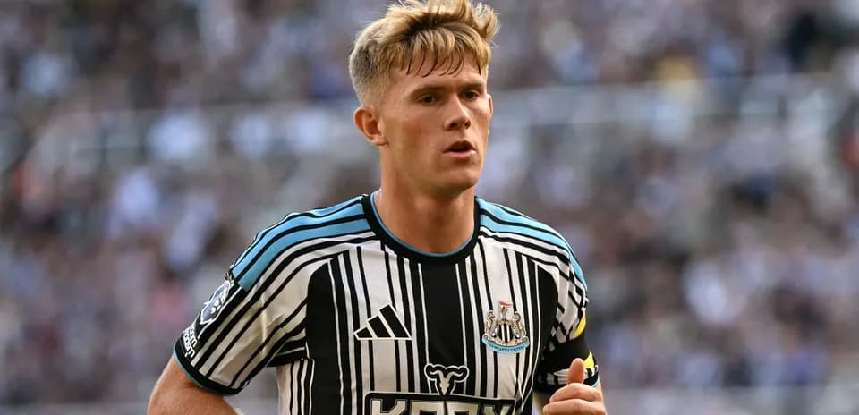 Newcastle player running on the pitch during match