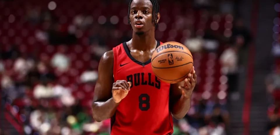 Player holding basketball during game warm-up