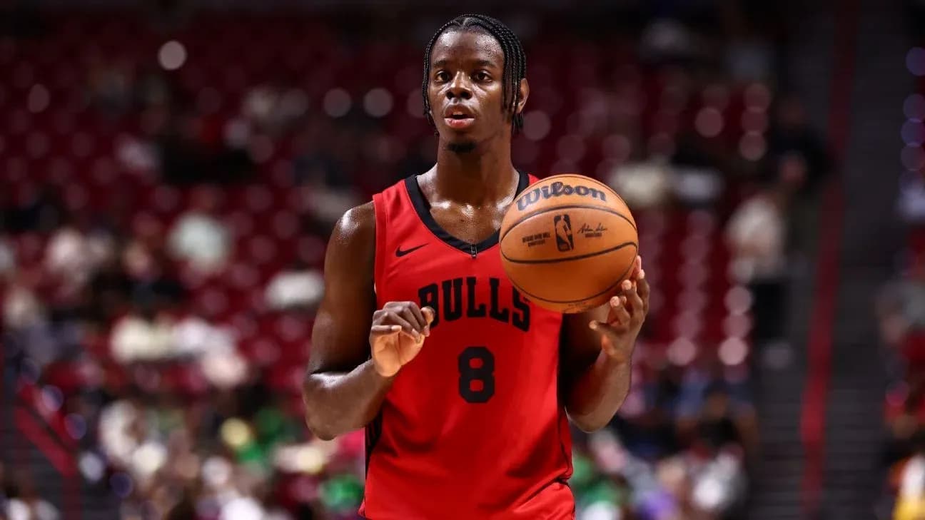 Player holding basketball during game warm-up