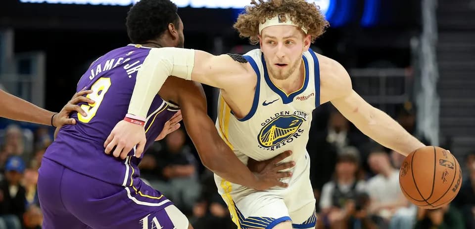 Player dribbling the ball while being guarded
