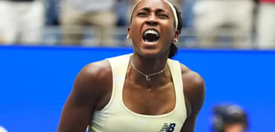 Tennis player celebrating victory during match