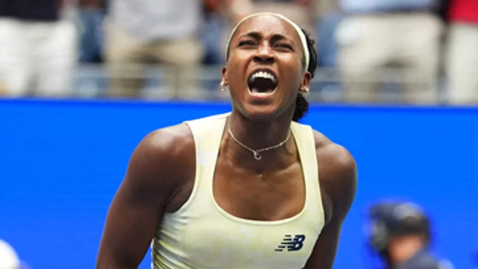 Tennis player celebrating victory during match