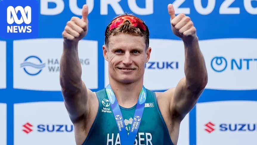 Athlete celebrating with thumbs up after race