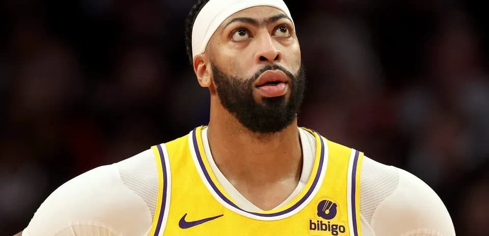 Player in Lakers jersey looking up during game