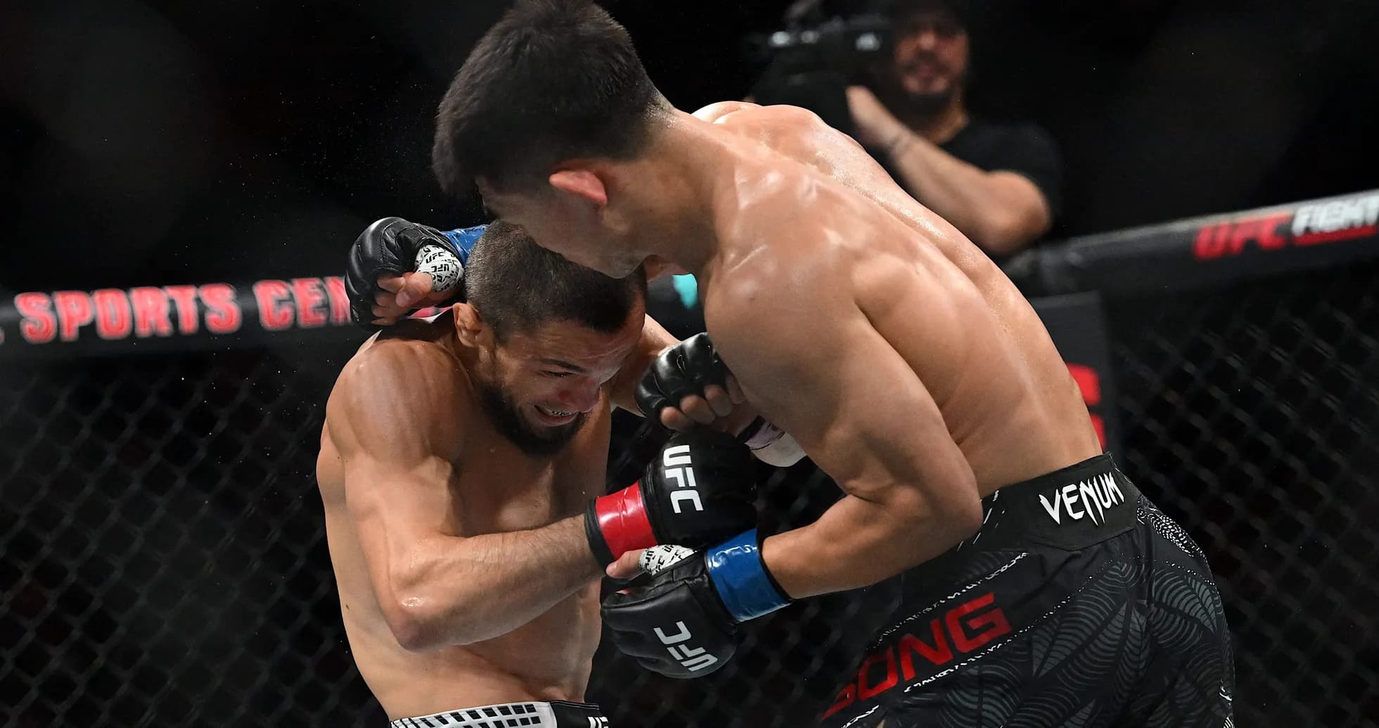 Two fighters exchanging punches in UFC match