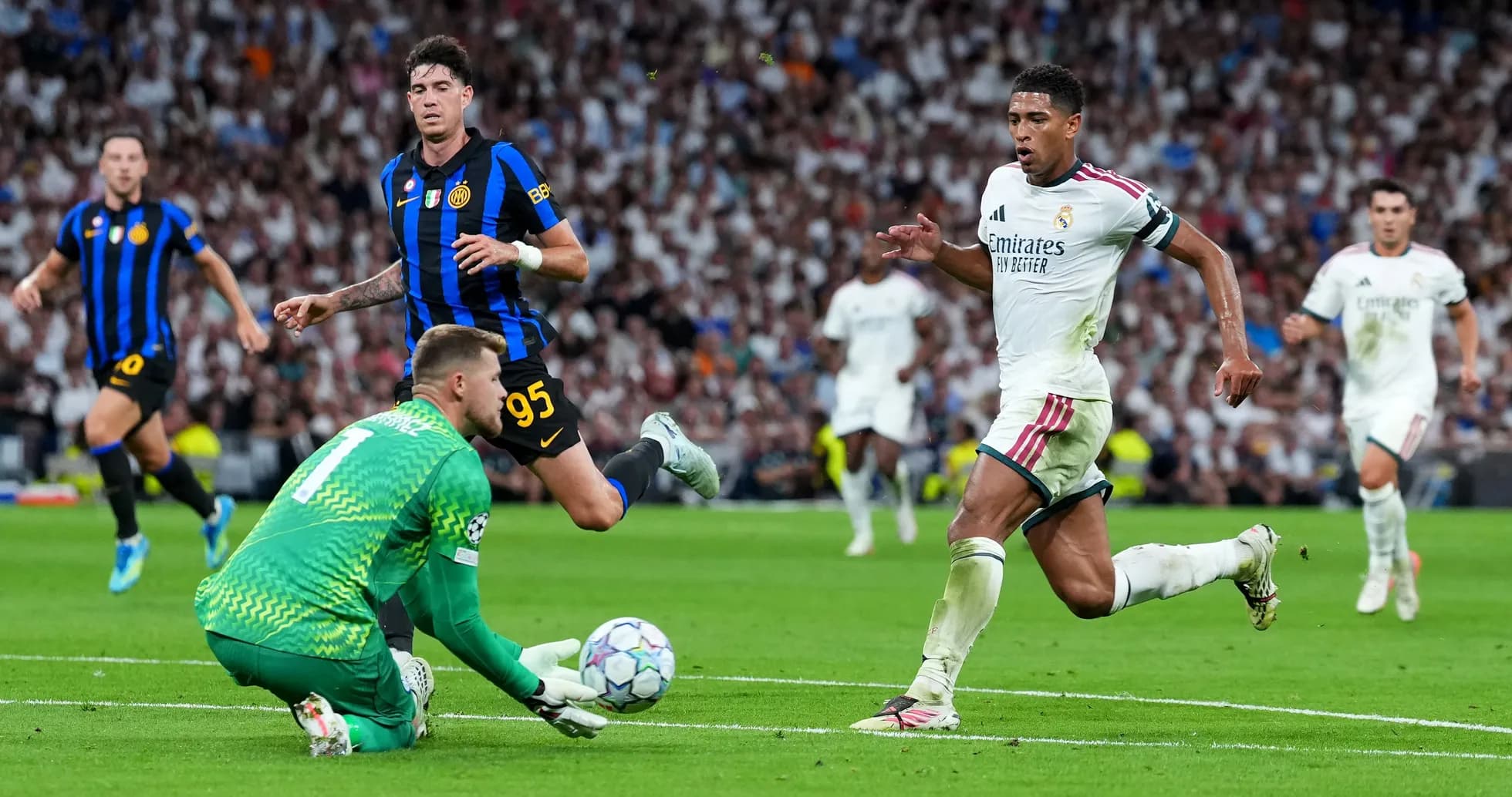 Real Madrid player running past goalkeeper in match