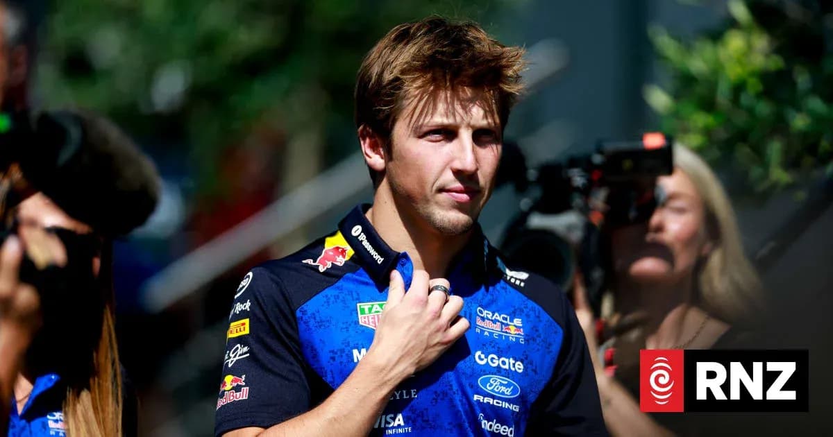 Driver in team uniform during media event