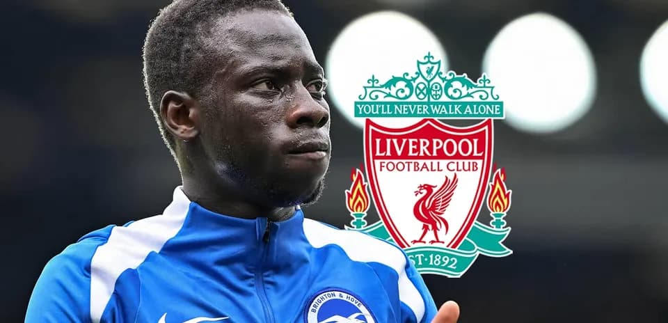 Brighton player with Liverpool logo in background
