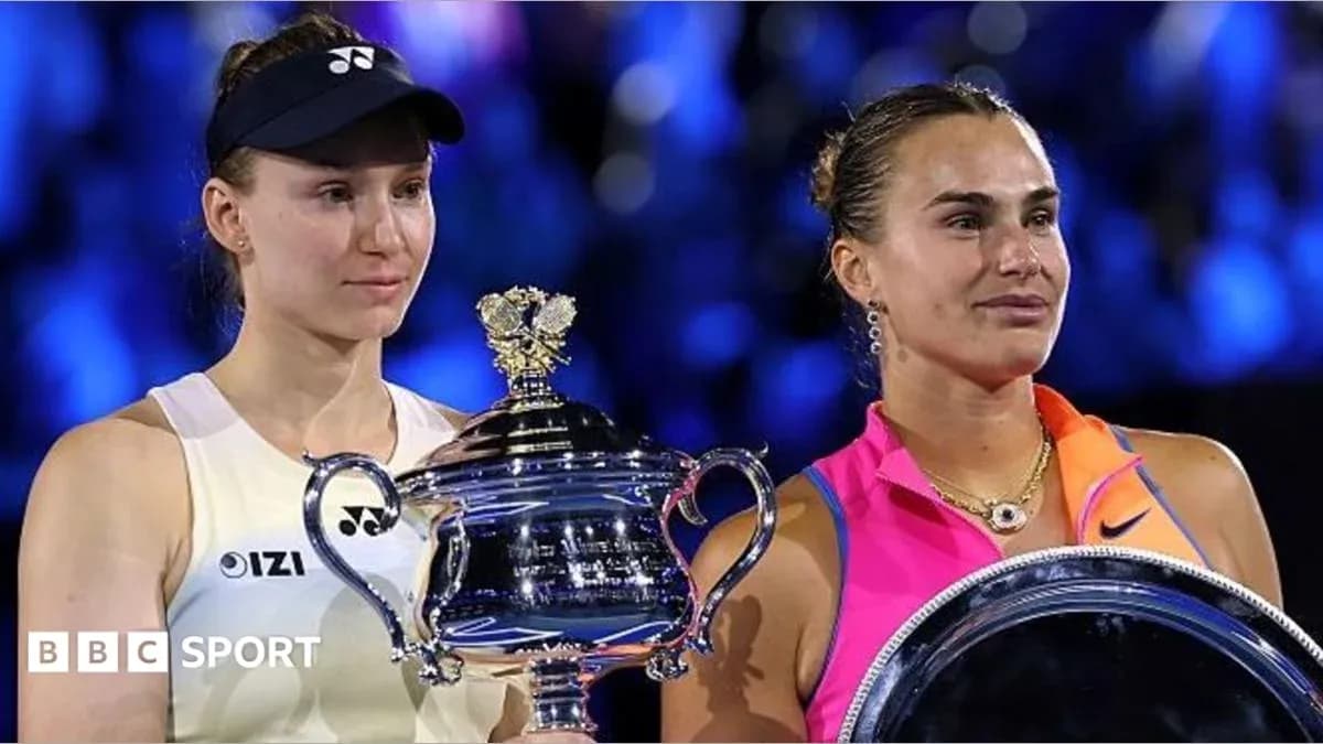 Two tennis players holding trophies after match