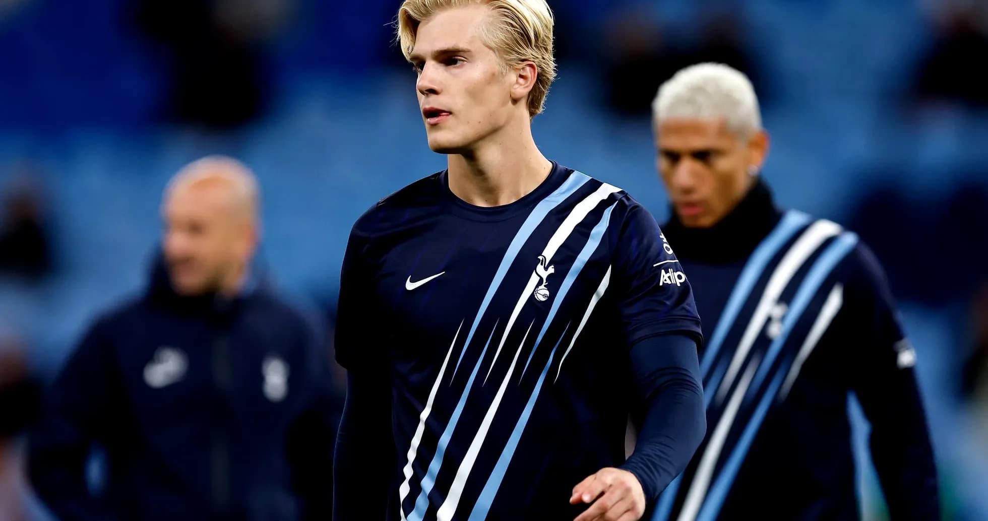 Player in Tottenham kit walking during warm-up