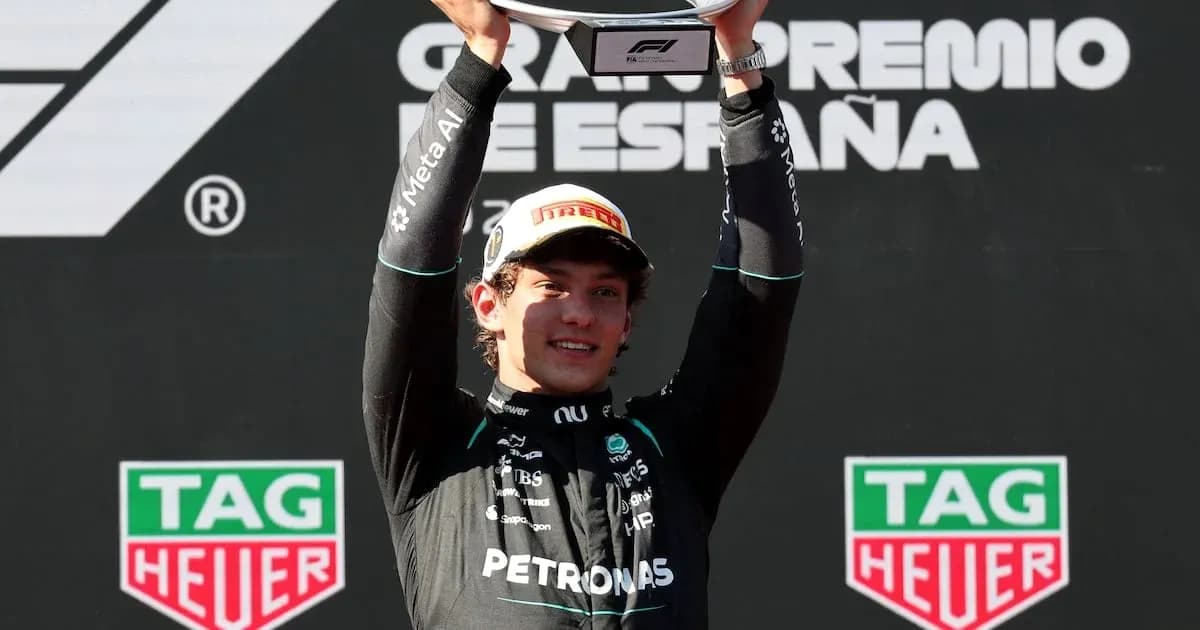 Driver celebrating with trophy at Spanish Grand Prix