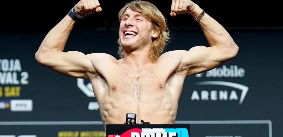 Fighter flexing muscles during weigh-in event