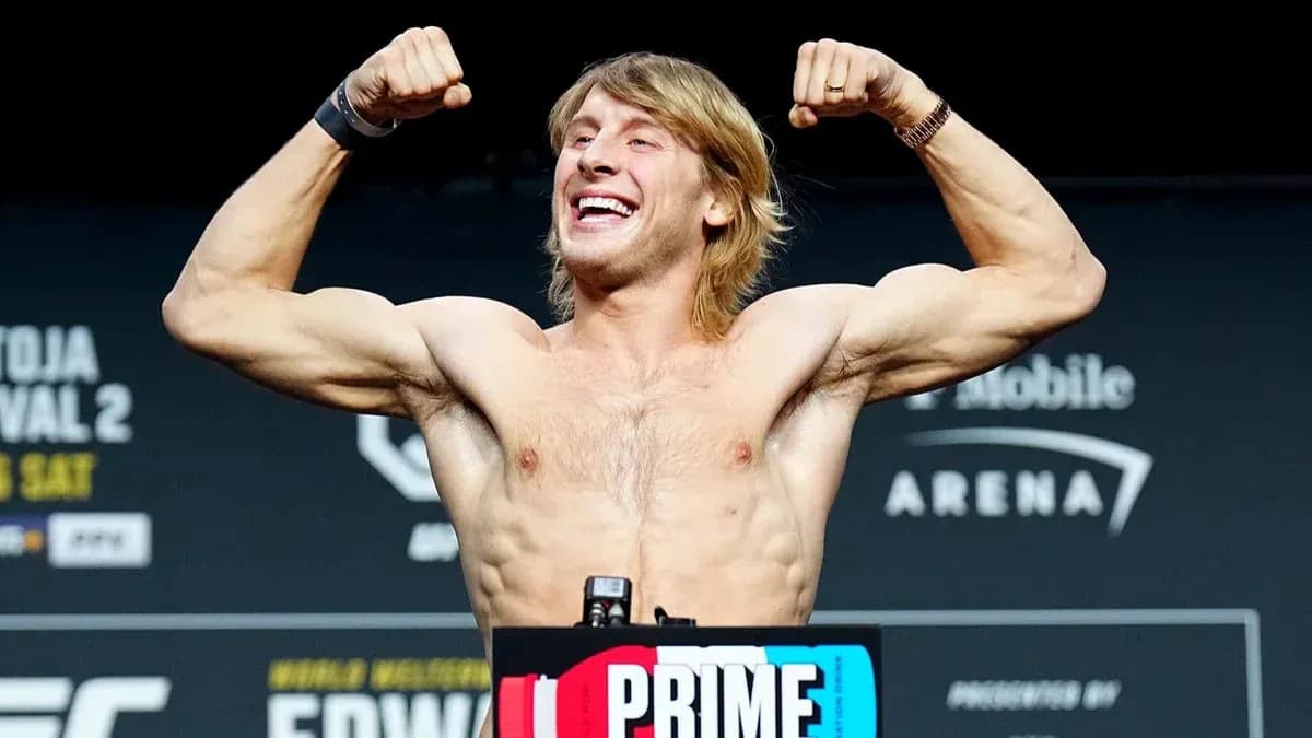 Fighter flexing muscles during weigh-in event
