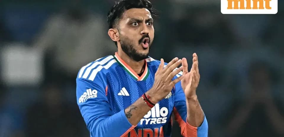 Cricketer celebrating during a match in blue jersey