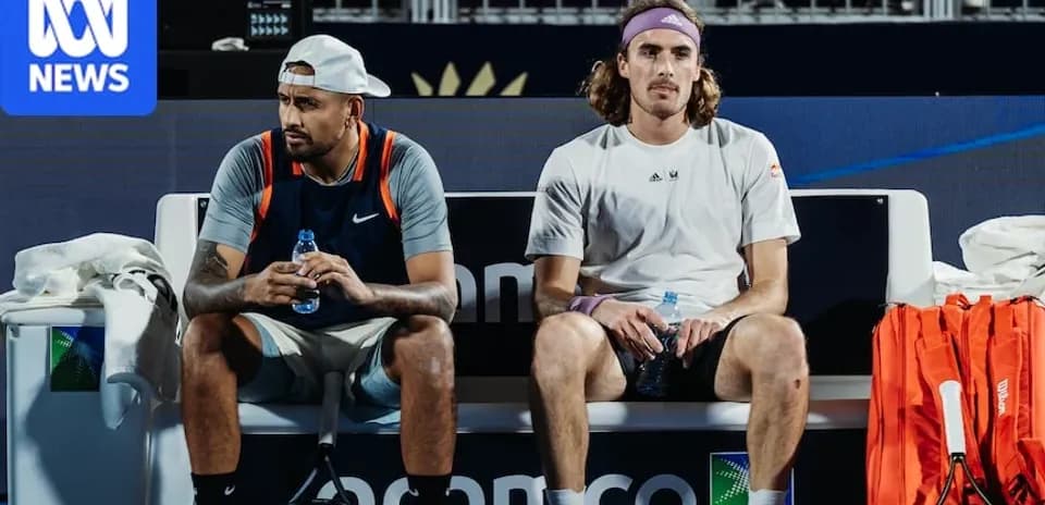 Nick Kyrgios and Stefanos Tsitsipas sitting on bench