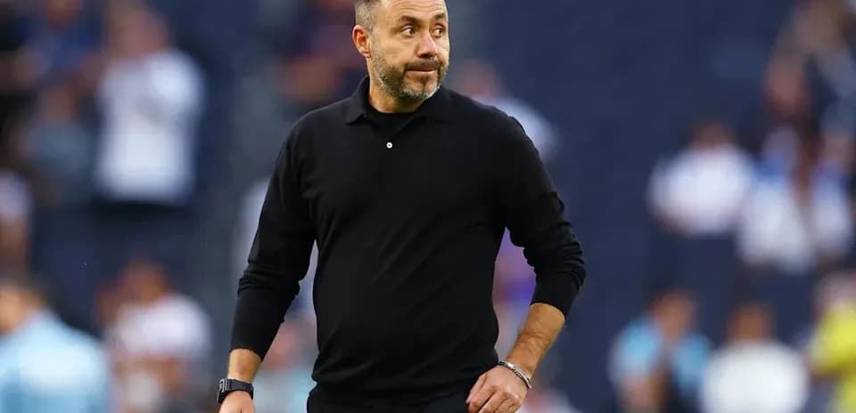 Coach walking on the sidelines during match