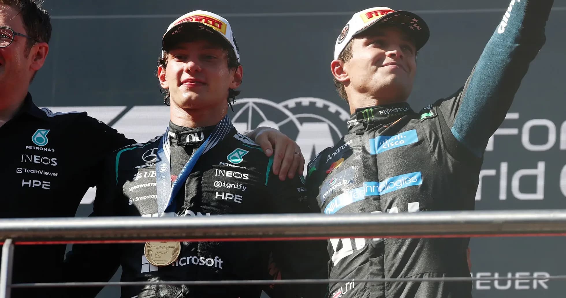 Drivers celebrating on podium after race victory
