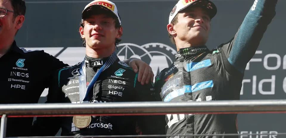 Drivers celebrating on podium after race victory