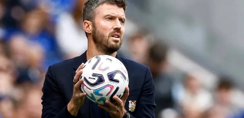 Coach holding ball during match preparation