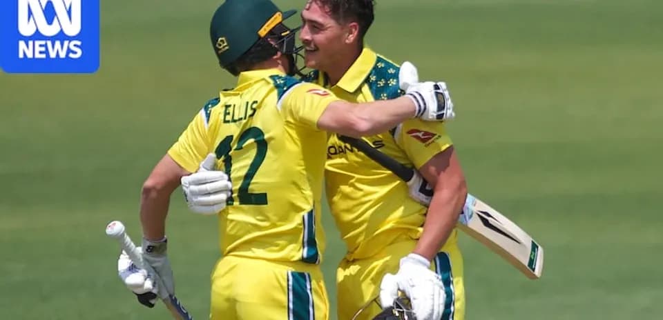 Two Australian cricketers celebrating after a run