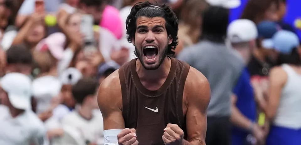 Tennis player celebrating victory with raised fists