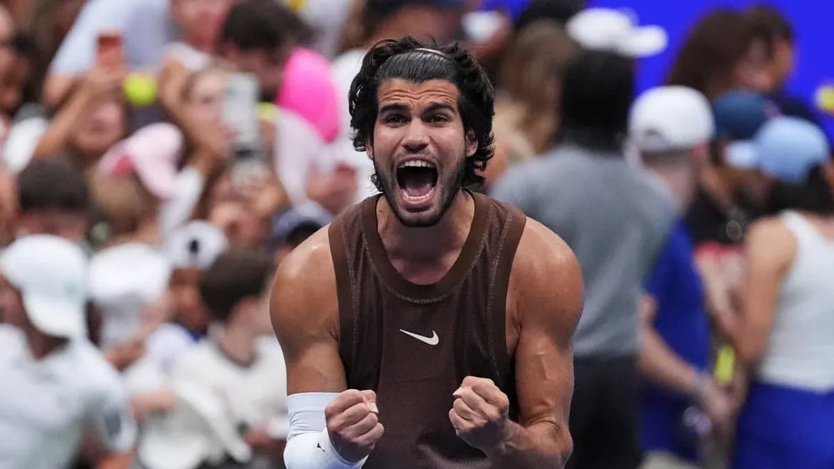 Tennis player celebrating victory with raised fists