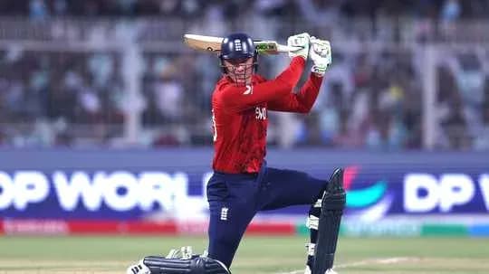 Batsman playing a shot in cricket match