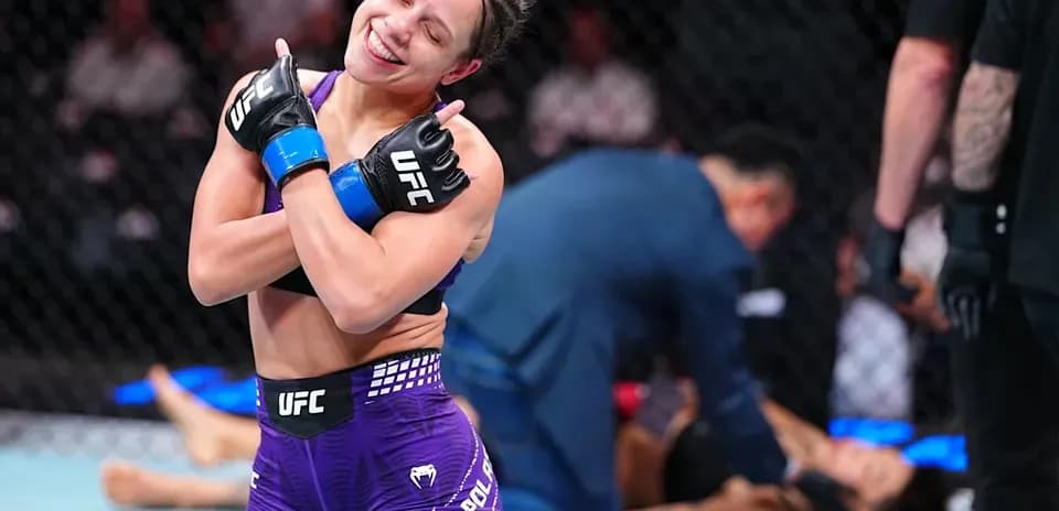 Fighter celebrating victory in the octagon