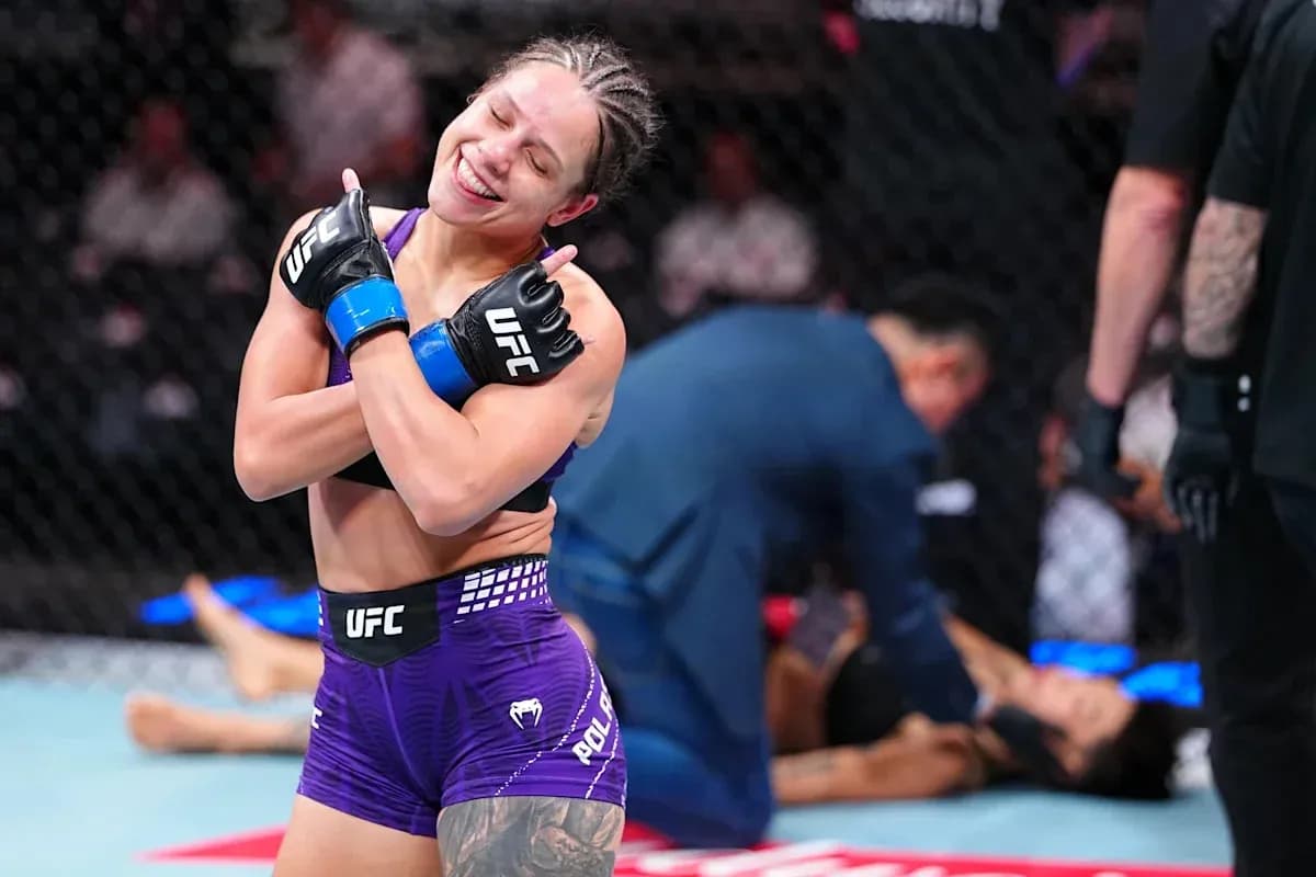 Fighter celebrating victory in the octagon